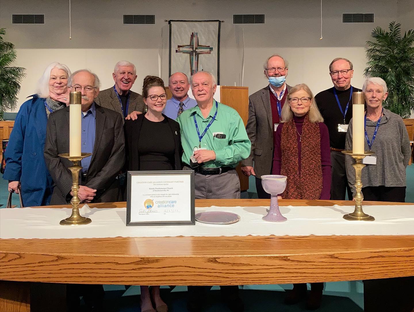 CCA Director Sarah Ogletree with members of Trinity Presbyterian Church in Hendersonville after presenting them with their covenant partner certificate. 